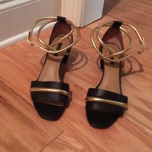 A black and gold Rachel Zoe Sandal with Heel.